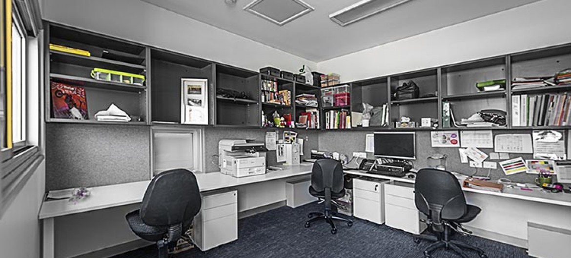 Interior Office with Three Desks and Chairs, Wall Shelving