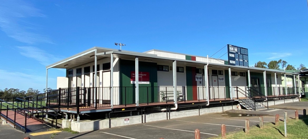Portable Sports Building with Green and Red Paint